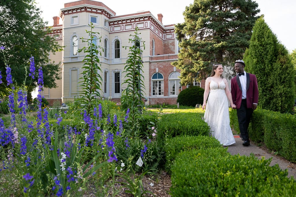 French inspired wedding Kansas City, the castle and the King and Queen walking in the garden