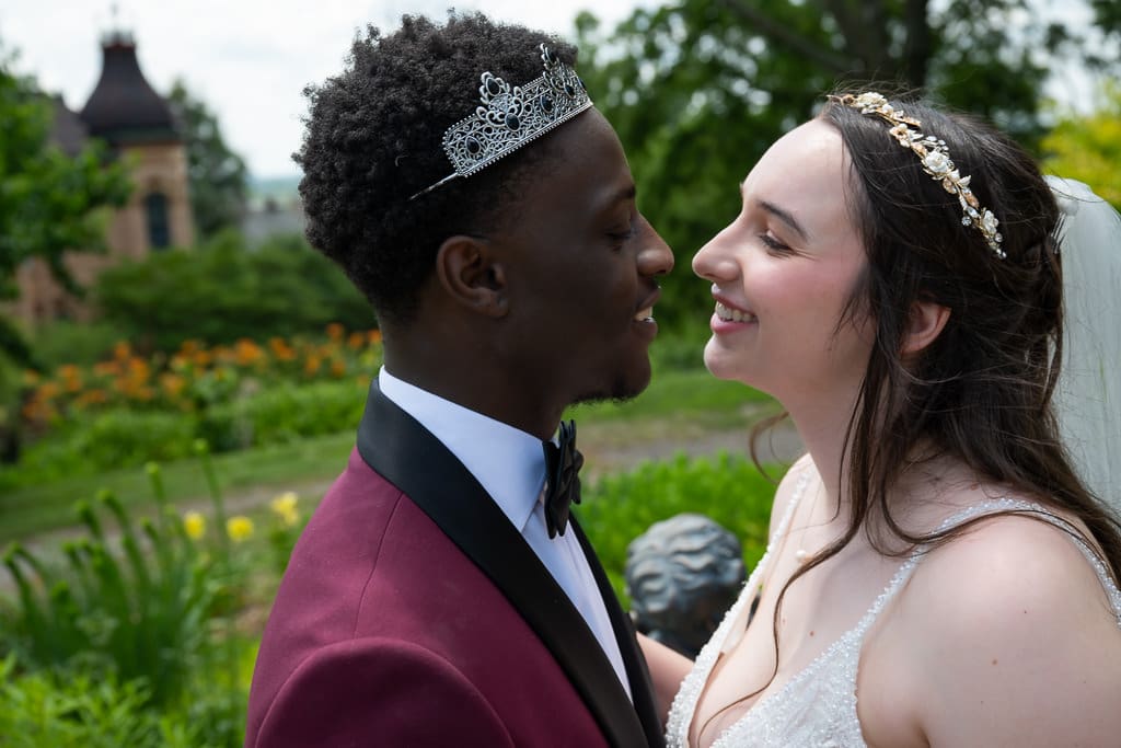 Couple portrait in the garden of Wyethtootle Mansion in Saint Joseph Missouri.