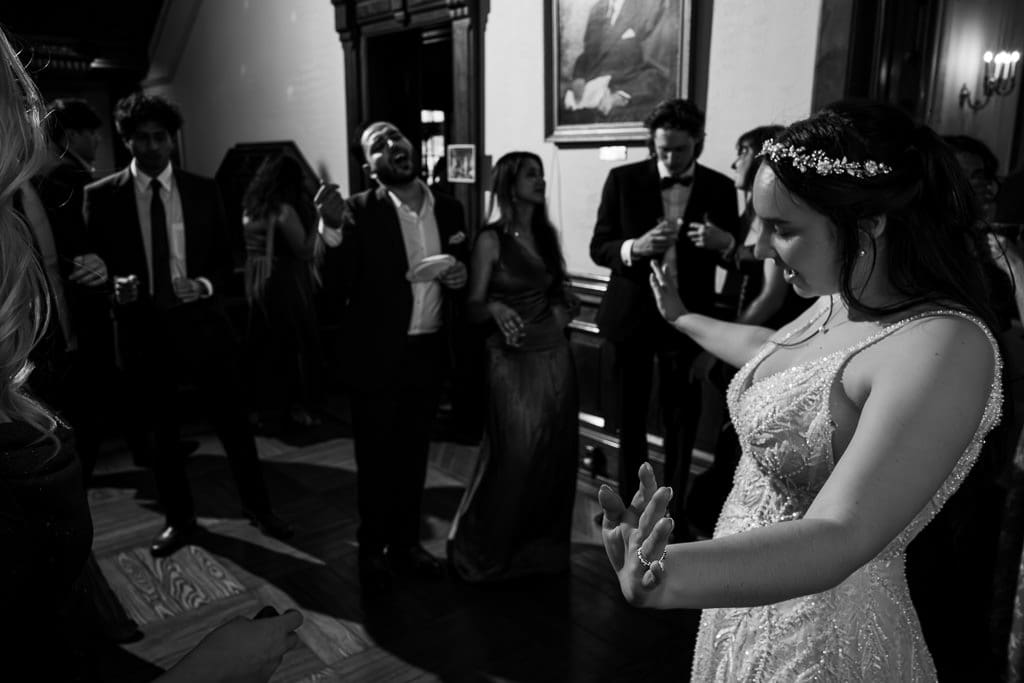 Guests and bride dancing at her French-inspired wedding at Wyeth-Tootle Mansion in St. Joseph, Missouri