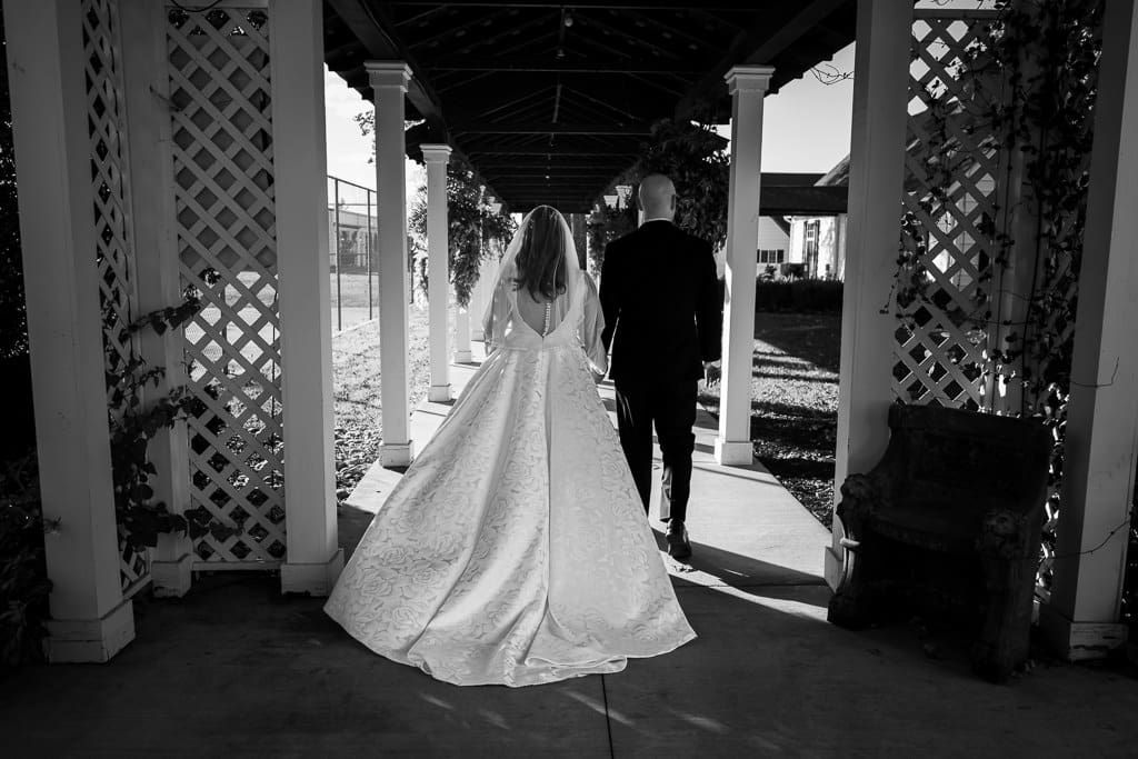 couple walking to reception Lone Summit Ranch Wedding