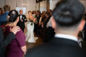 Bride and father walking down the aisle of Union Kansas City