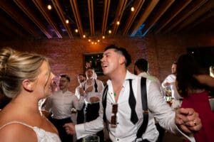 Groom and bride energetically dancing