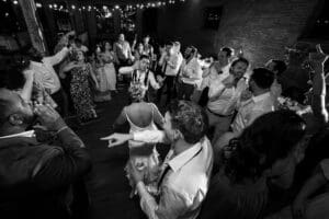 Guests celebrating the couple in a circle during the dance party