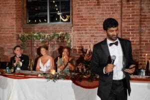 Best man giving a speech during a multicultural wedding ceremony at Union Kansas City