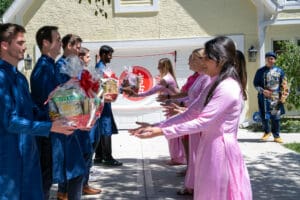 Groomsmen offering gifts during Vietnamese tea ceremony