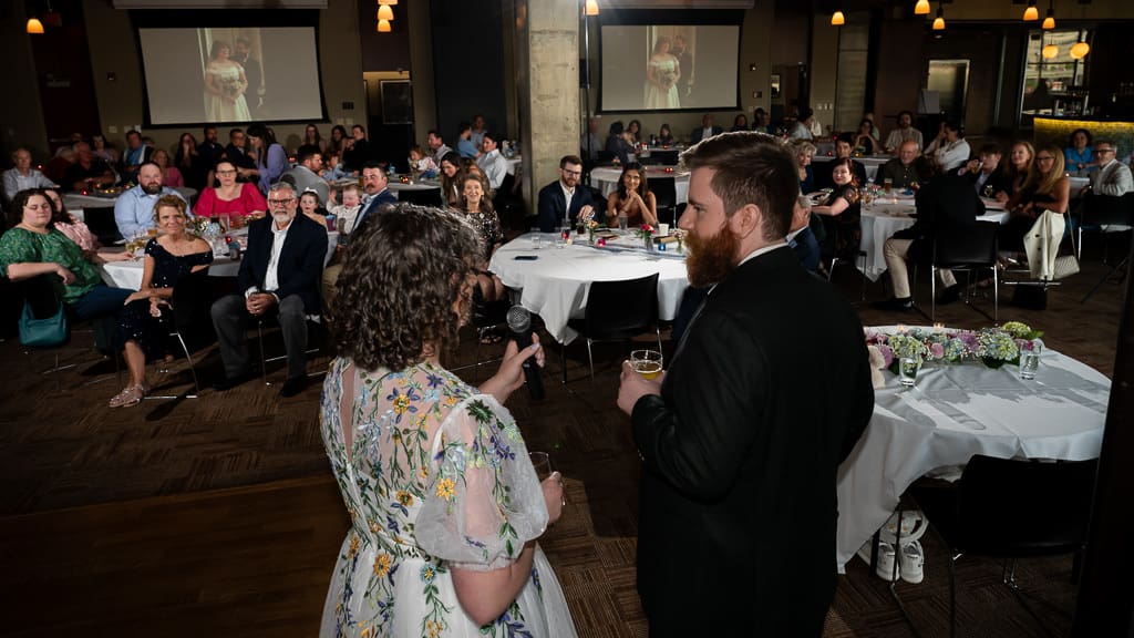 Bride and groom giving a speech to their guests at the wedding reception at Boulevard Brewing Company