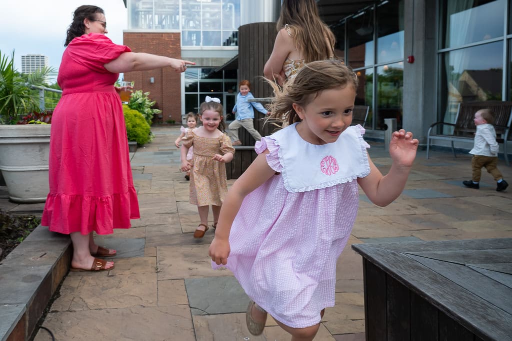 Children running and playing on the terrace during a wedding at Boulevard Brewing Company