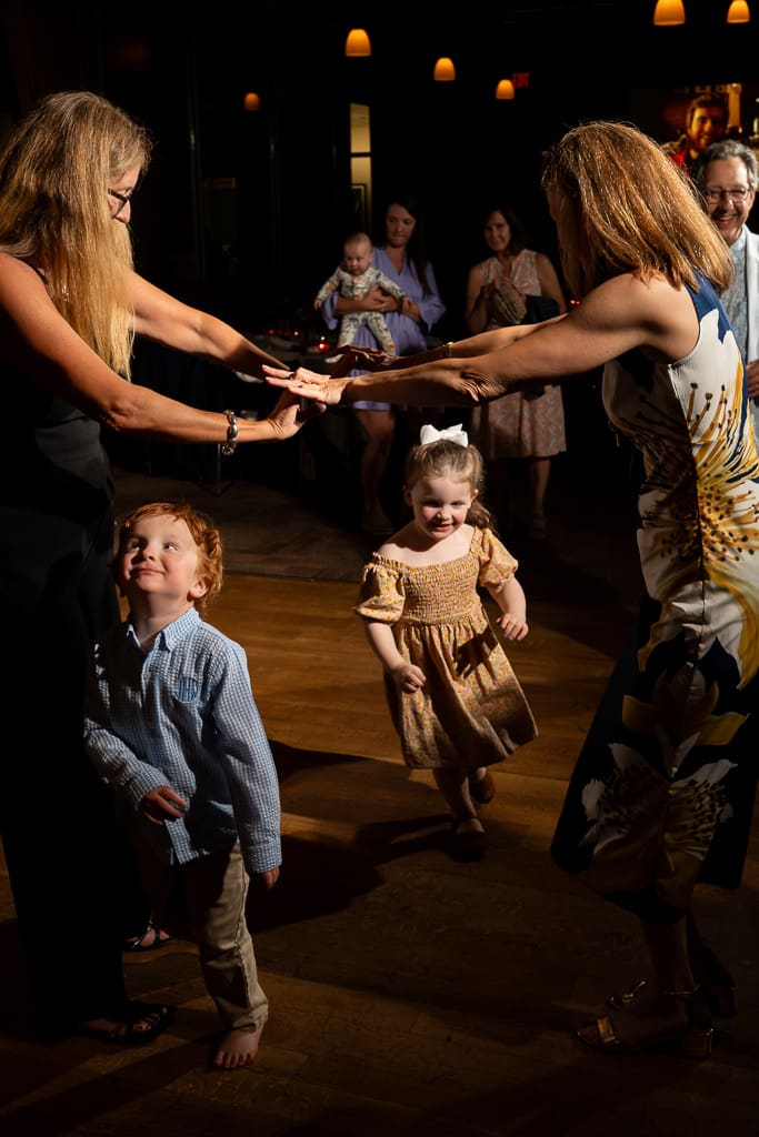 Children dancing with guests on the dance floor at the wedding reception