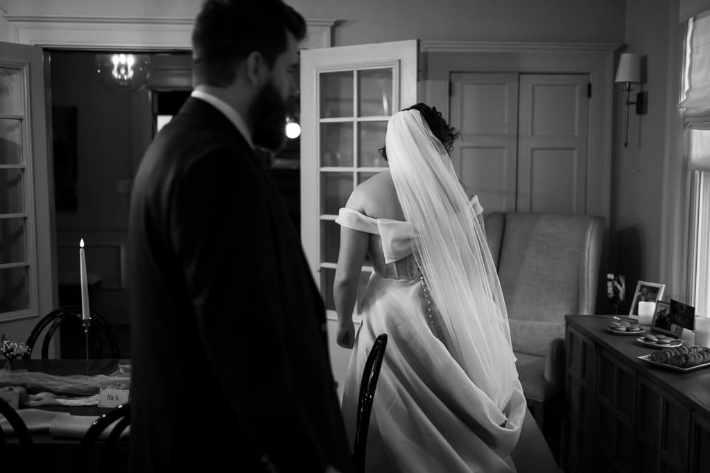 Black and white photo of the bride and groom in a quiet moment inside Southmoreland on the Plaza