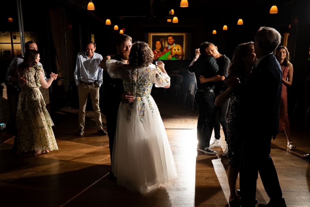 Bride and guests on the dance floor during the wedding reception at Boulevard Brewing Company in Kansas City