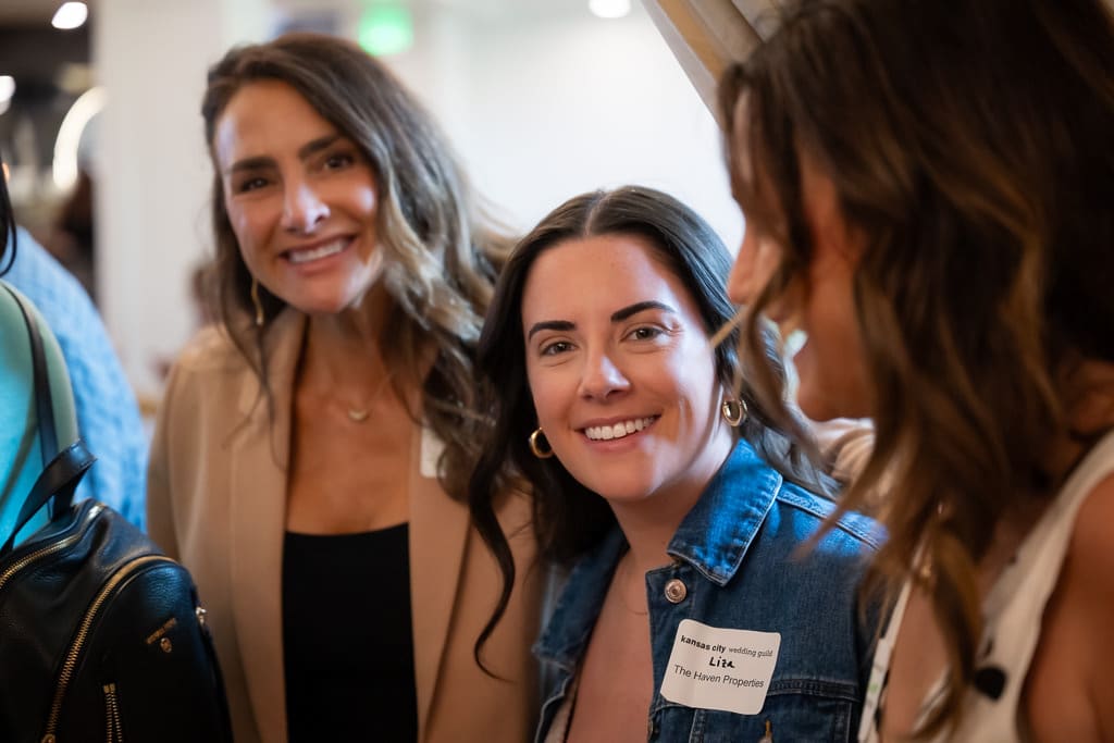 Two wedding vendors smiling at the camera during a networking event at Melrose Abbey