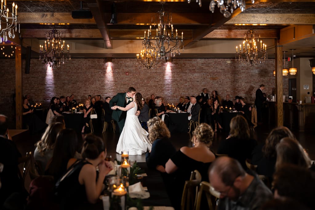 Drake and Tamieka share their first dance under chandeliers in the center of The Stanley as guests watch